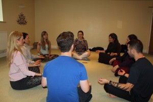 group sitting in meditation