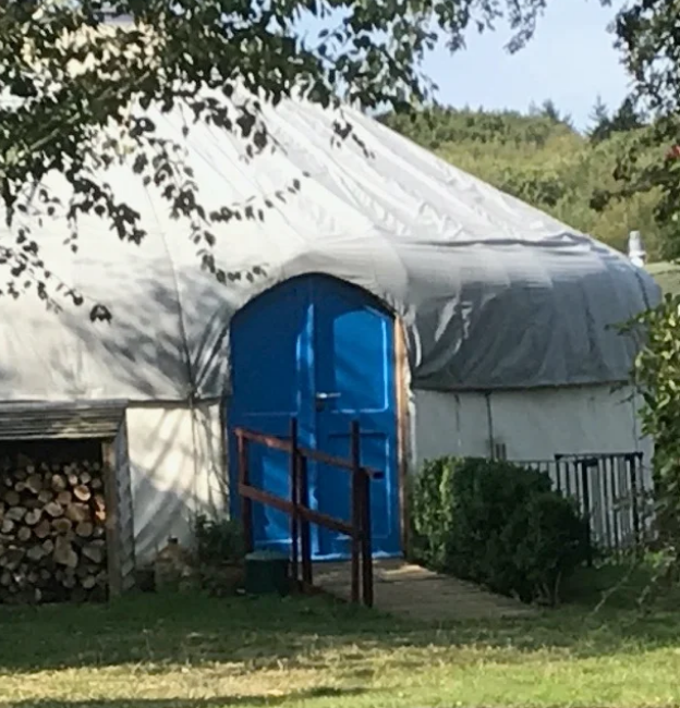 yurt with blue door