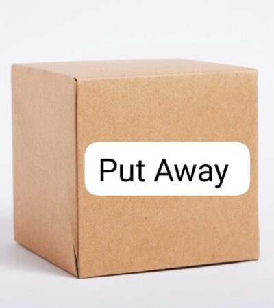 cardboard box with text "put away"