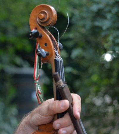 Picking up a violin with a broken string